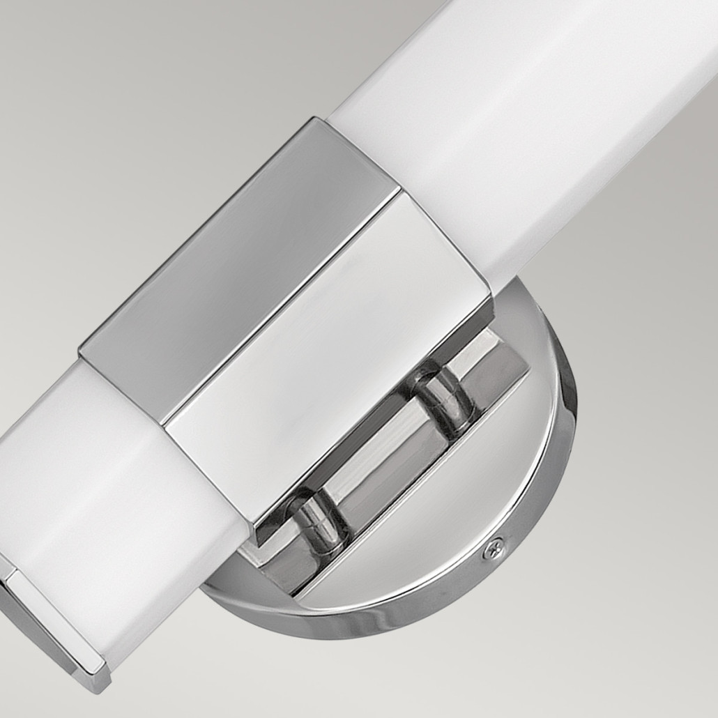 Бра для ванных комнат вертикальное с длинным белым матовым плафоном в форме шестиугольника на круглом основании Hinkley