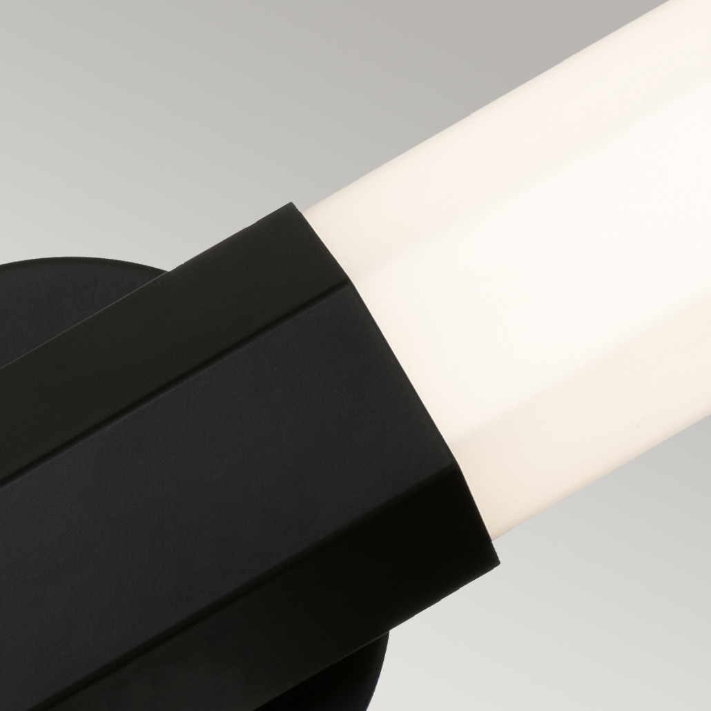 Бра для ванных комнат вертикальное с длинным белым матовым плафоном в форме шестиугольника на круглом основании Hinkley