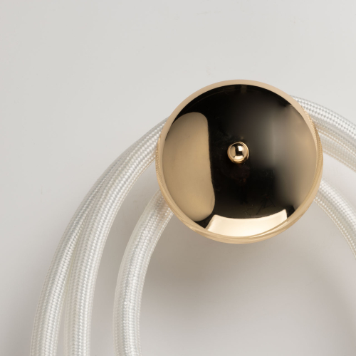 Бра с круглым золотистым основанием и белыми изогнутыми световыми линиями Luke Lampco Tracer Lamp