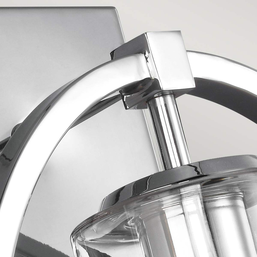 Бра цвета хром с круглой рамой и цилиндрическим прозрачным стеклянным плафоном на прямоугольном основании Feiss