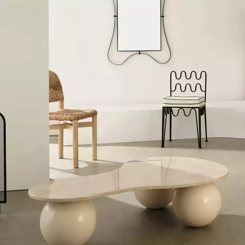 Дизайнерский журнальный стол с изогнутой столешницей на круглых ножках Rigilyr